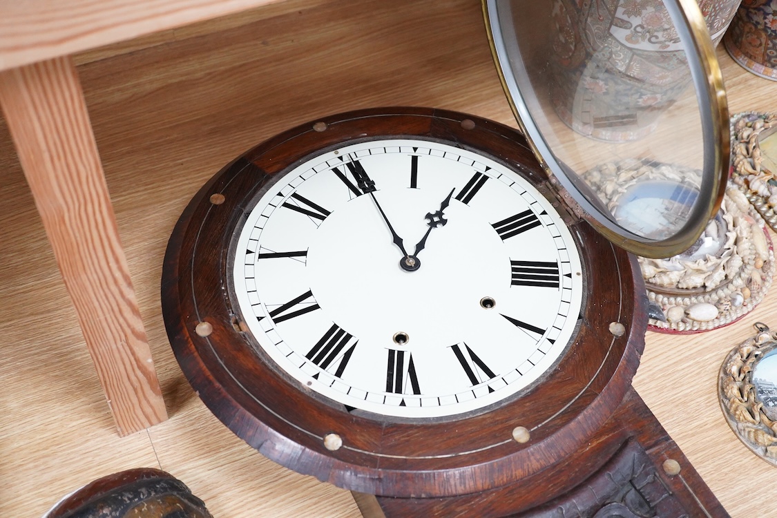 A late 19th century mahogany wall clock with mother of pearl inlaid discs, with pendulum and key, 67cm high